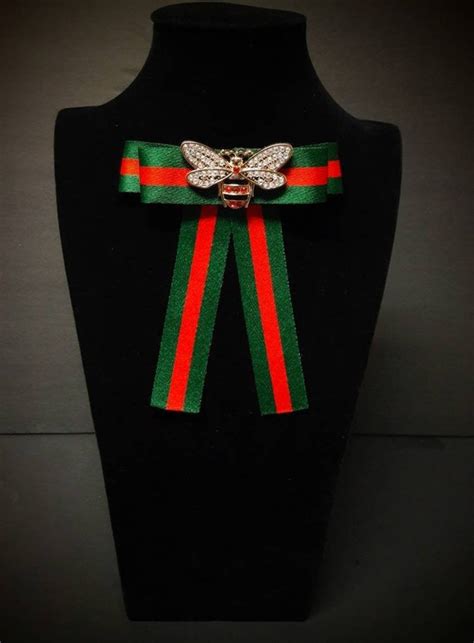 gucci snake lapel pin|Gucci bow tie brooch.